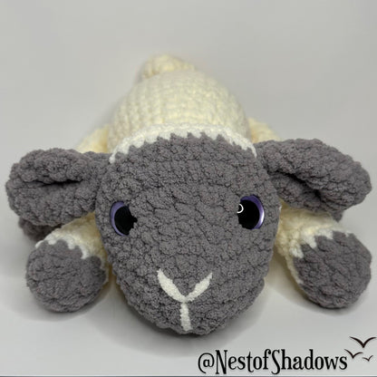 Gray and white crochet lab plushie with a white background and Nest of Shadows watermark.