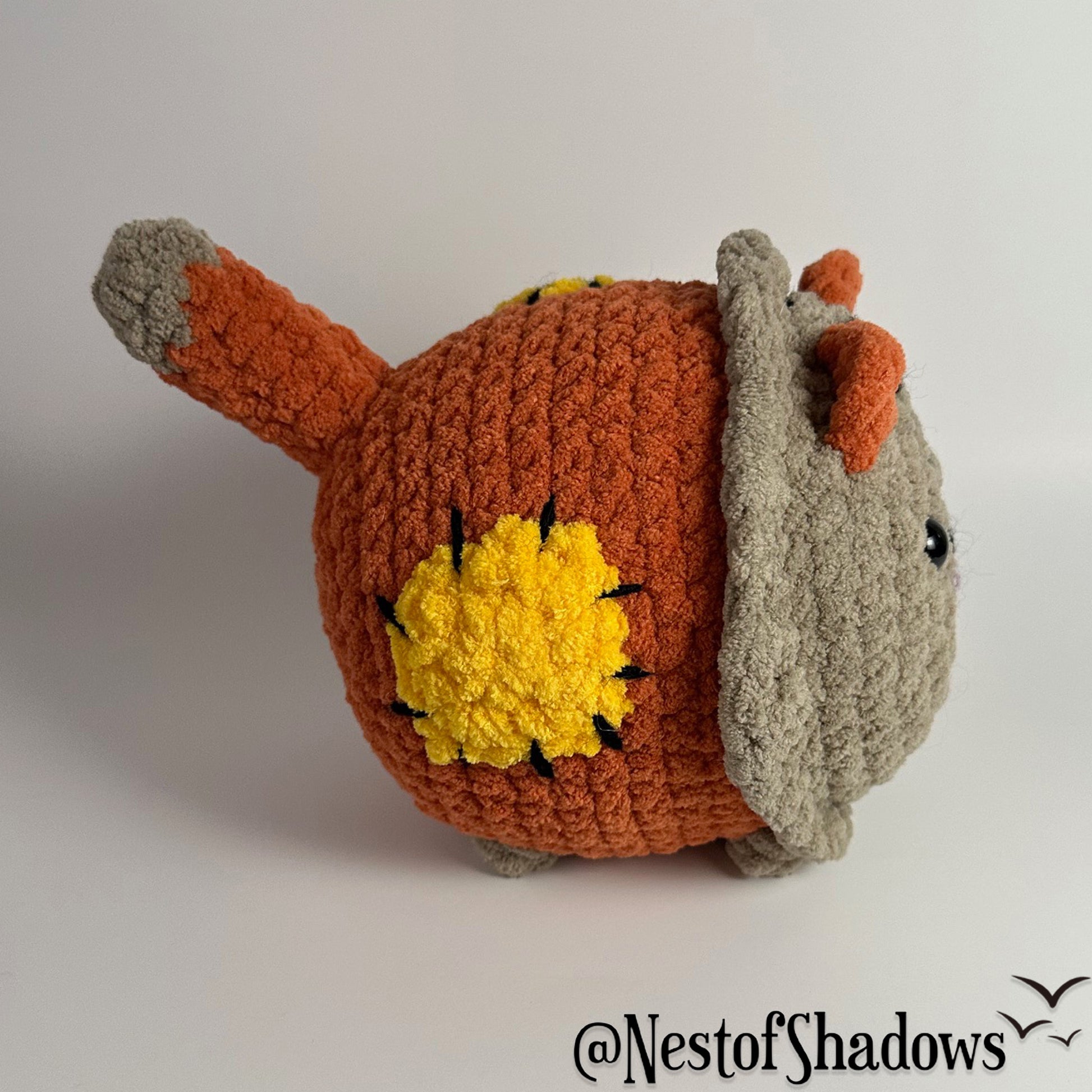 Crochet Cat on a white background. Nest of Shadows watermark.